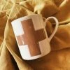 CREATIVE COOP Swiss Cross Mug - Cream + Brown
